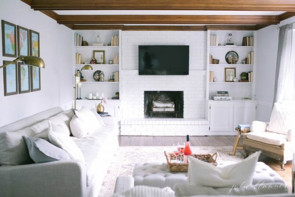 Cozy family room with rustic ceiling beams - love the built ins kellyelko.com