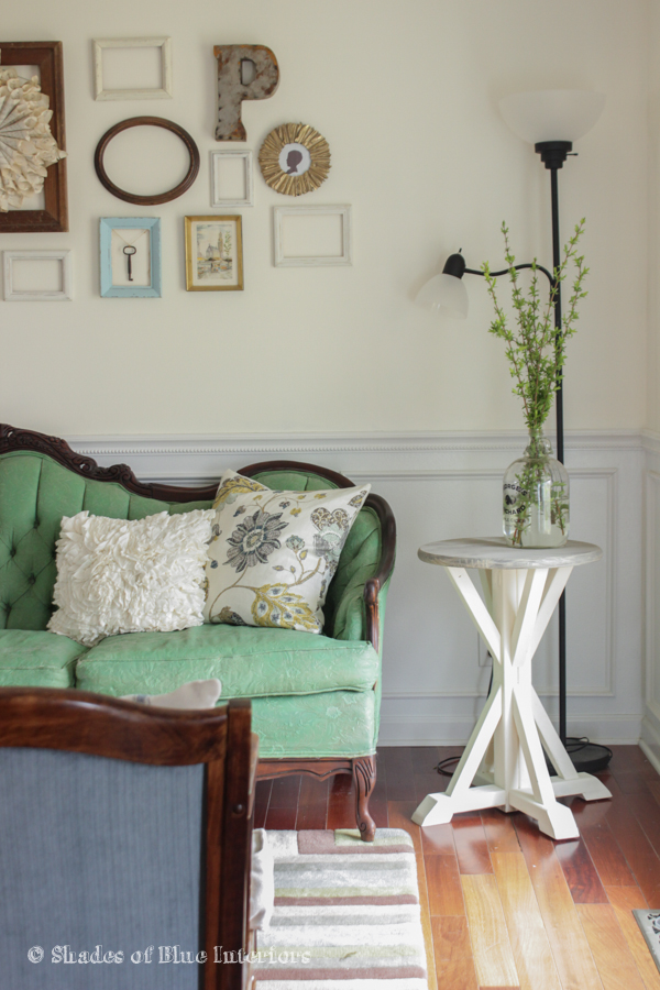 Love this eclectic gallery wall and the gorgeous vintage green sofa kellyelko.com