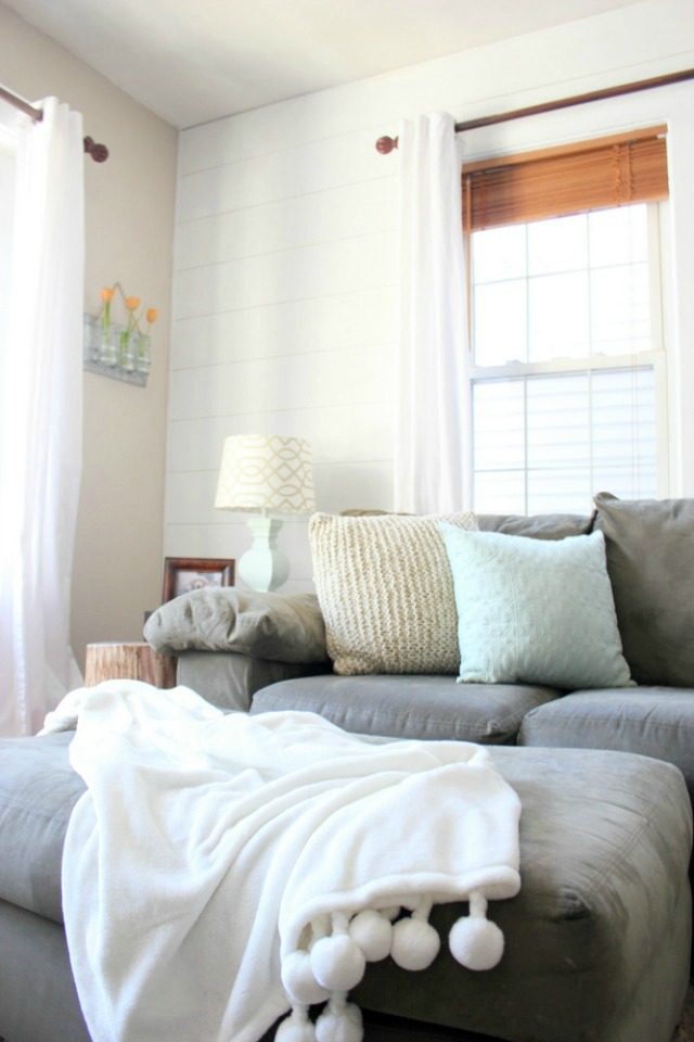 Love this neutral family room and the white shiplap wall kellyelko.com