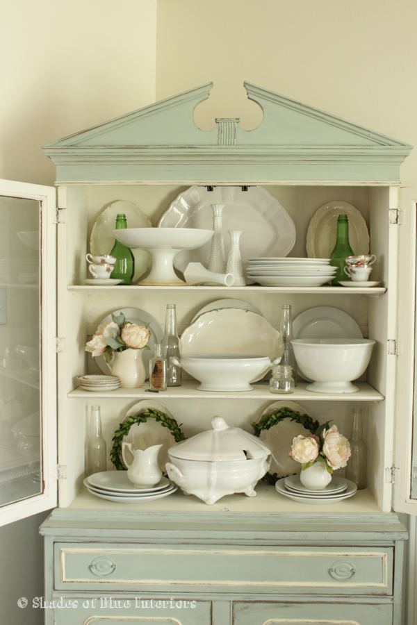 Corner hutch filled with beautiful collections - love the iron stone kellyelko.com