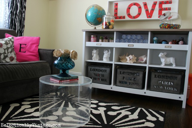 What a fun teen room - perfect for watching tv and hanging out and that storage cubby is great kellyelko.com