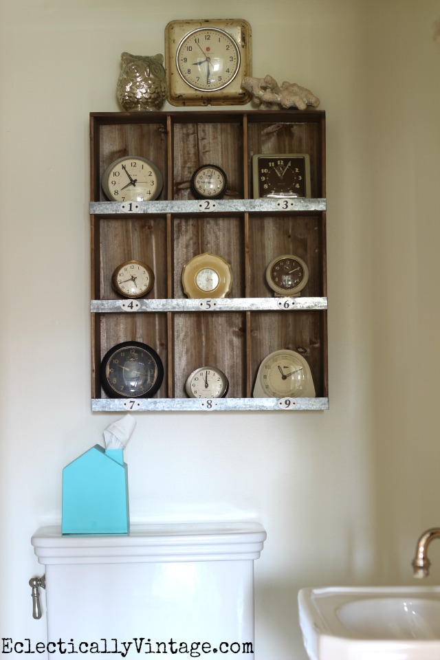 Love these rustic cubbies filled with this fun vintage clock collection kellyelko.com