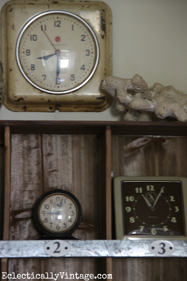 I love decorating with collections - these vintage clocks look great in these rustic cubbies kellyelko.com