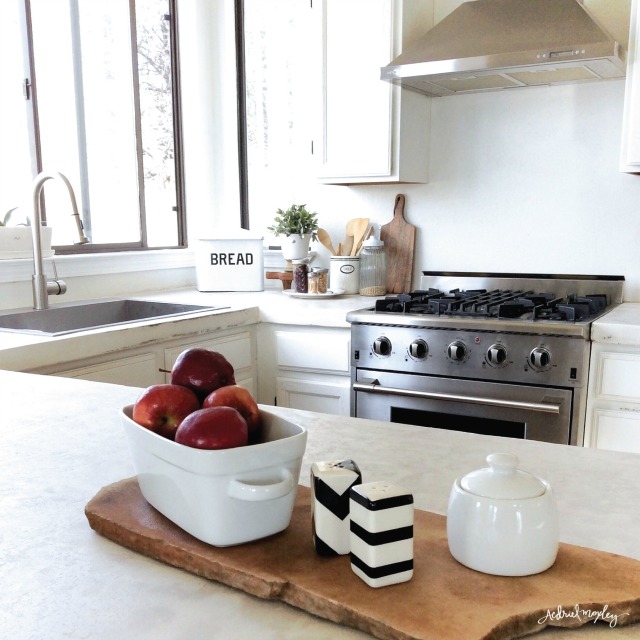 Beautiful light filled white kitchen - love the huge windows over the sink kellyelko.com