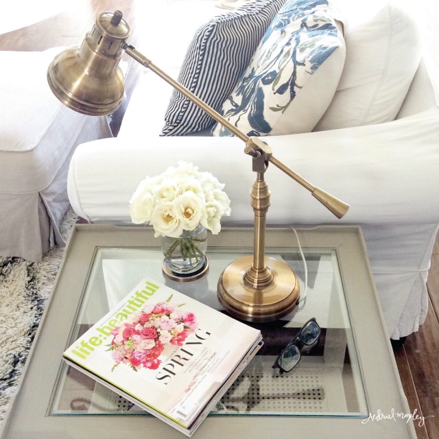 Brass pharmacy lamp is perfect on a living room end table kellyelko.com