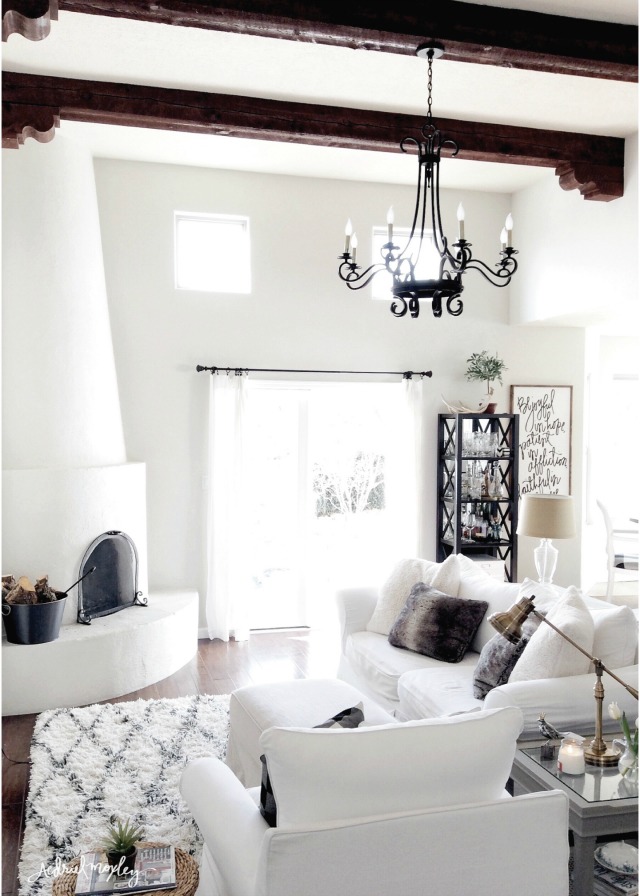 Eclectic Home Tour of Aedriel Moxley - love the architectural details like the wood beam ceiling and the adobe fireplace kellyelko.com