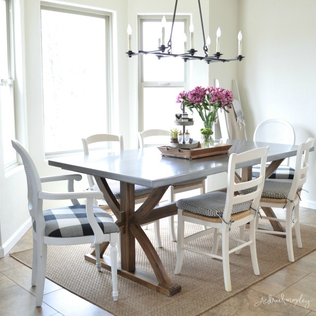 Love this wood and stainless steel dining table - the perfect mix of farmhouse and industrial kellyelko.com