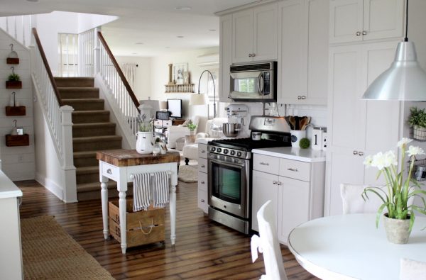 Country kitchen done on a tiny budget - love the gray kitchen cabinets and the butcher block island kellyelko.com