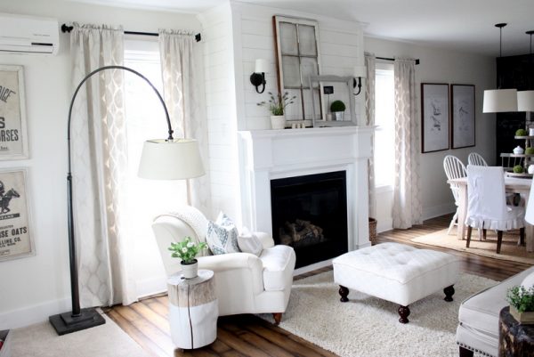 Love this cozy living room - the mantel is simple but beautiful and love the arched floor lamp kellyelko.com