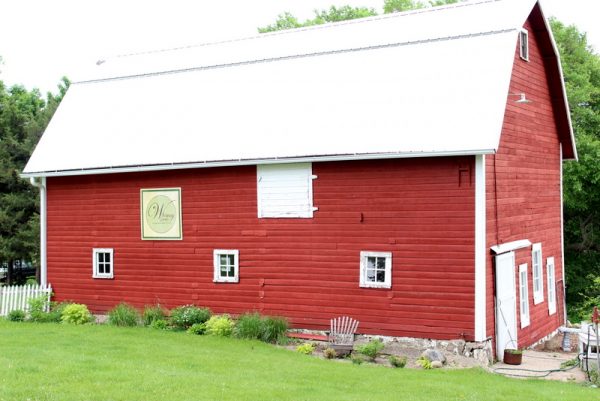 Gorgeous red barn is part of this three acre property with gorgeous home kellyelko.com