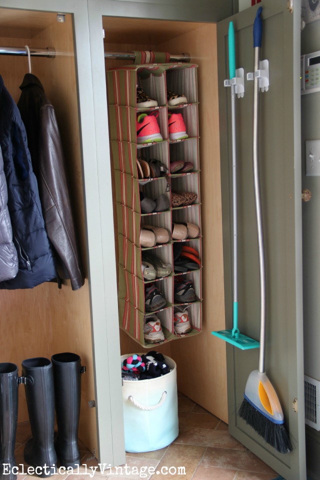 Love this organized mudroom - the shoe storage and the way she hung the brooms! kellyelko.com