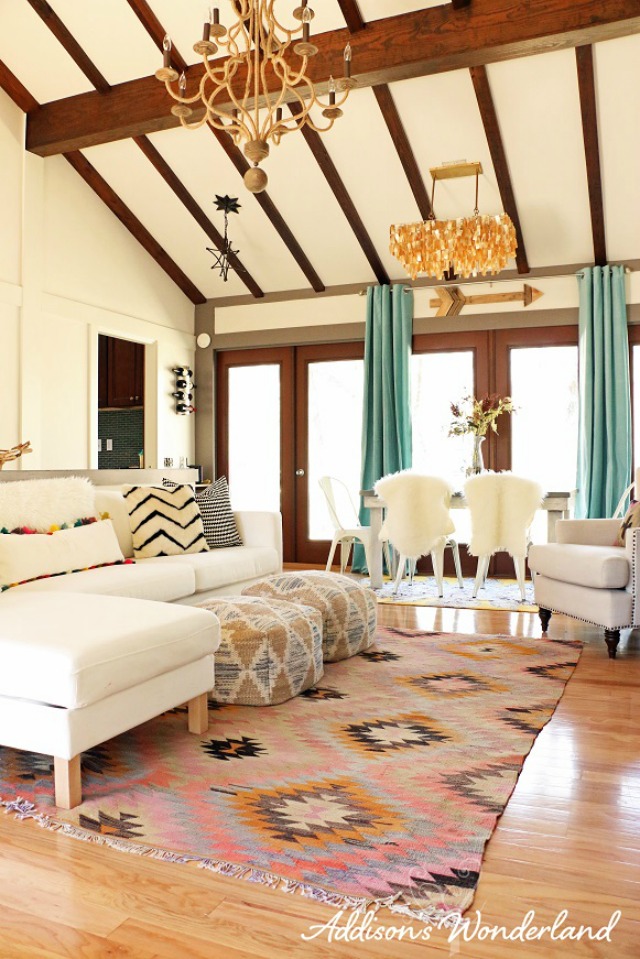 Love the high ceilings and rustic beams in this colorful home kellyelko.com