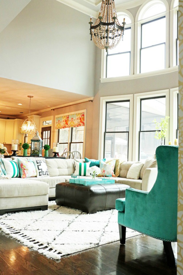 Colorful family room - love the high ceilings and open floor plan kellyelko.com