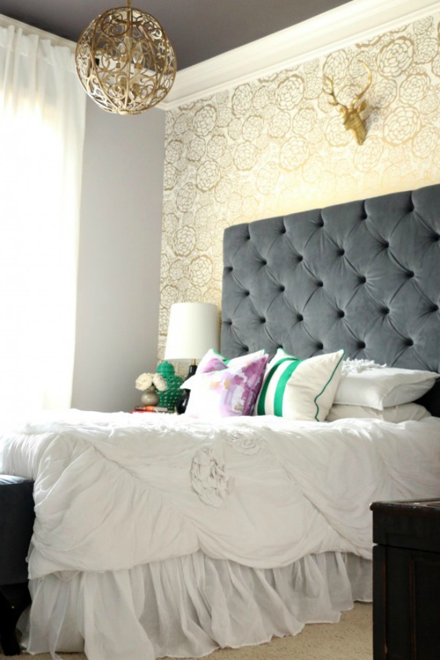 Glam gold bedroom with dramatic tufted headboard kellyelko.com