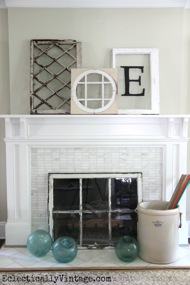 Love this cute summer mantel with a collection of antique windows and the window fireplace screen kellyelko.com