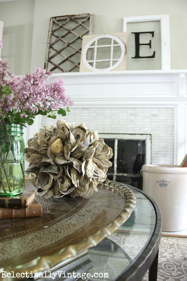 Love this antique window mantel and the accessories on the coffee table - look at that oyster shell ball! kellyelko.com 