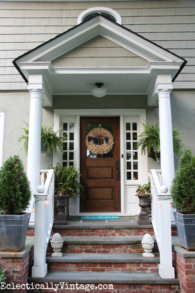 Love this summer front porch - the buoy lights are so cool and love that wreath kellyelko.com