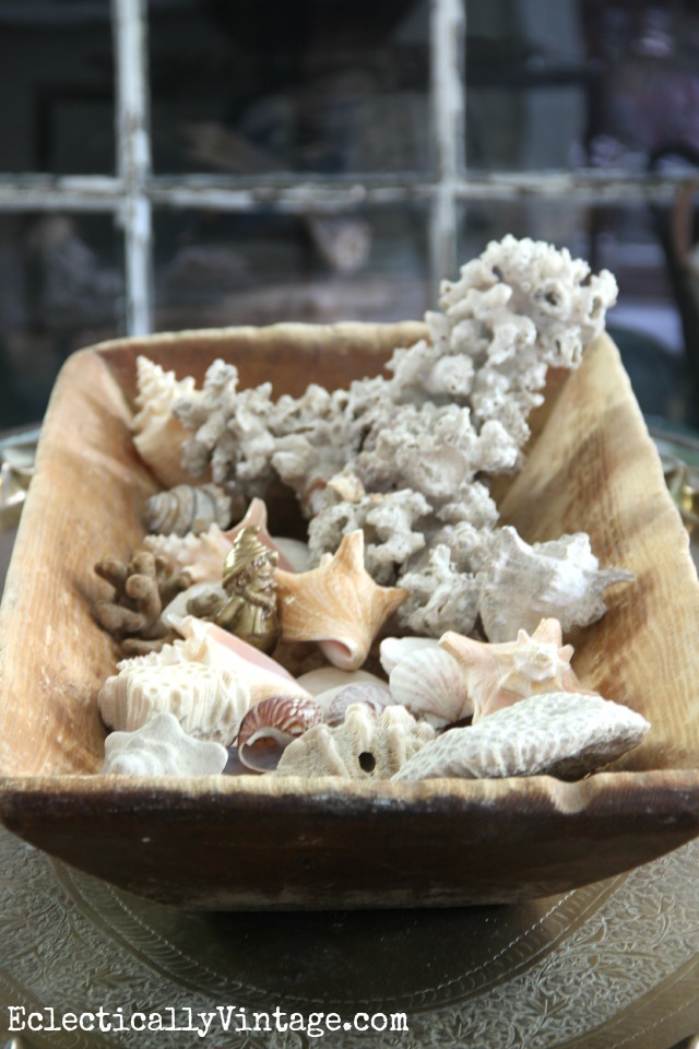 Love this vintage dough bowl filled with shells kellyelko.com