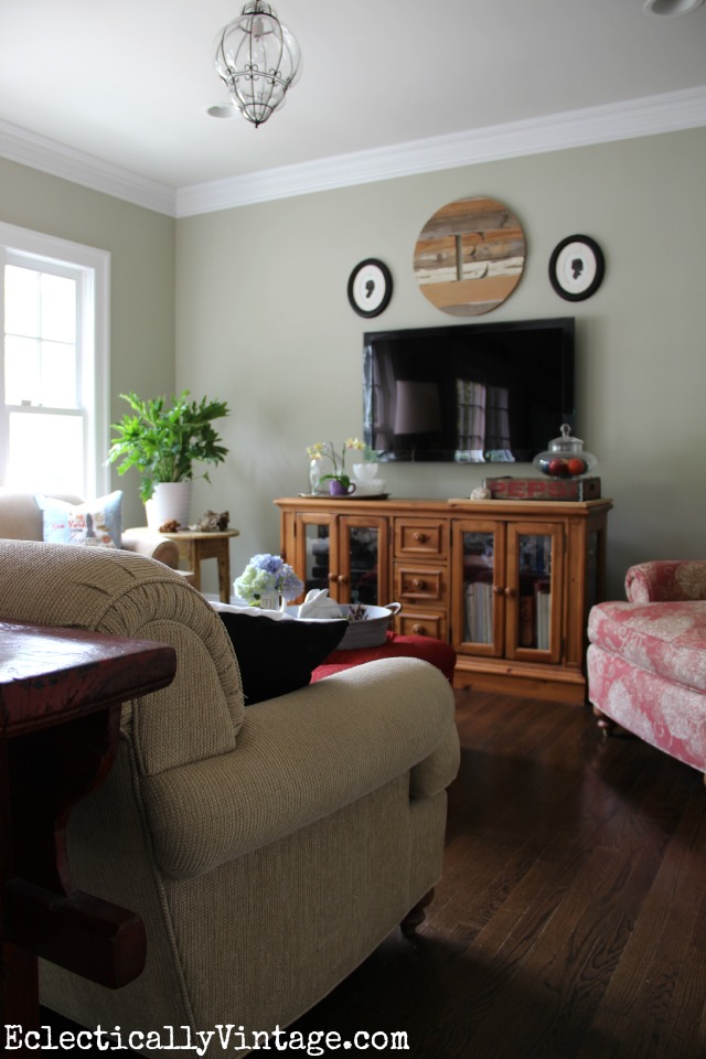 Love this cozy family room and the wood monogram over the tv kellyelko.com