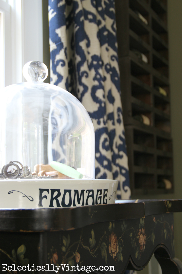 Love this vintage fromage cheese platter - she displays a collection of old corkscrews under the cloche kellyelko.com