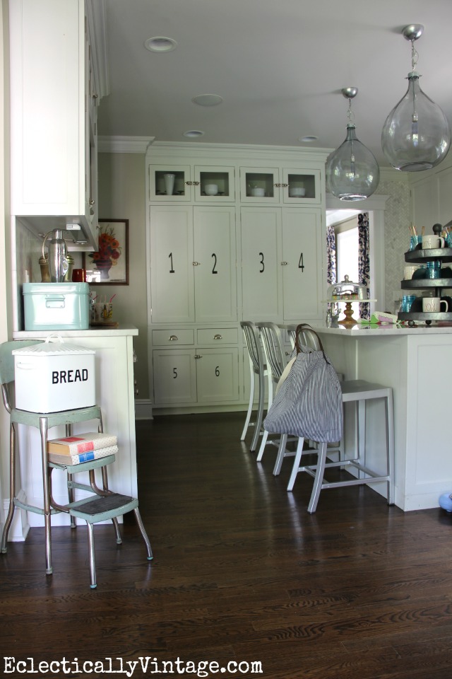 Love that huge numbered pantry wall in this gorgeous white kitchen kellyelko.com