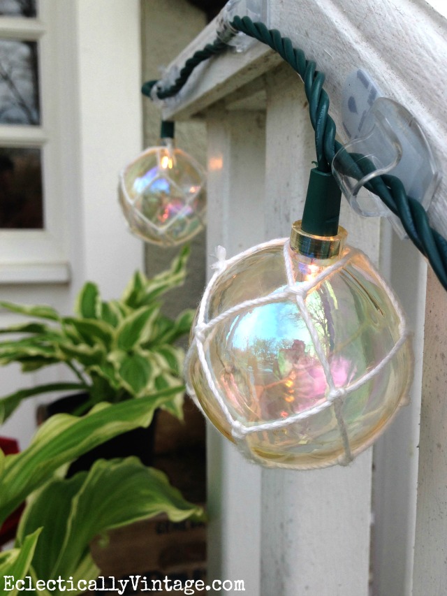 Love these buoy lights strung from the front porch - such a fun idea for summer kellyelko.com