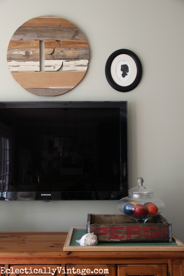 Love this wooden monogram over the tv kellyelko.com