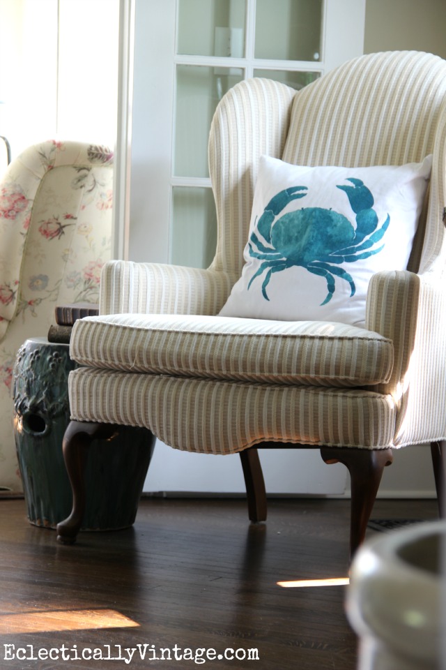 Cute little corner reading nook - love the blue crab pillow kellyelko.com