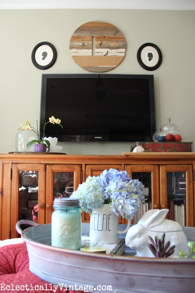 Love this weathered wood monogram from Ava Berry Lane over the tv in this cozy family room kellyelko.com