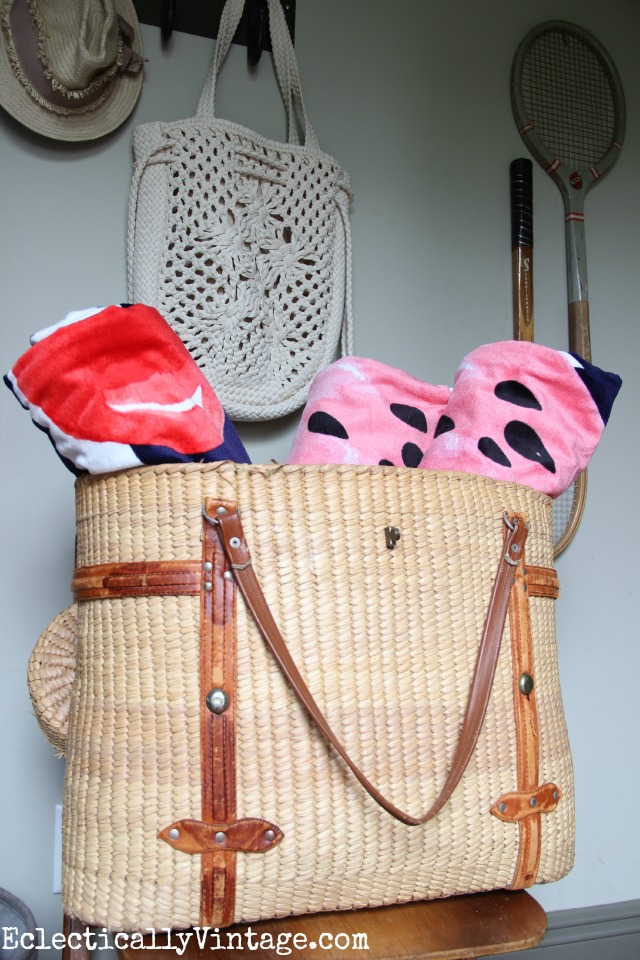 Love this vintage basket to hold beach towels kellyelko.com