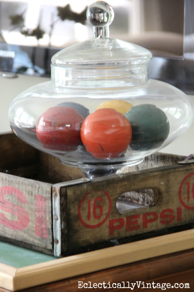 Vintage croquet balls displayed in a glass jar kellyelko.com