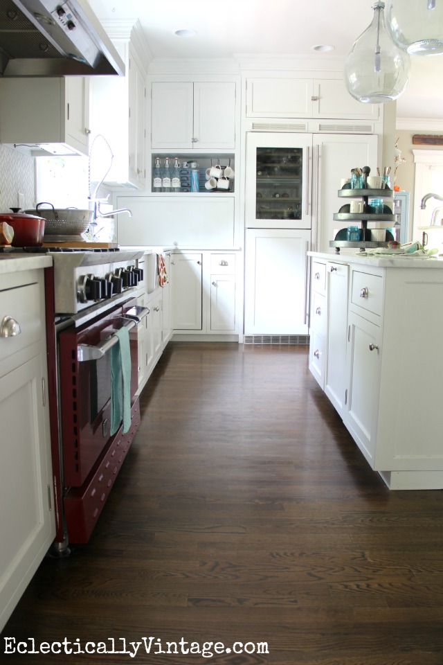 Love this white farmhouse kitchen with great attention to detail - the wine refrigerator is beautiful! kellyelko.com