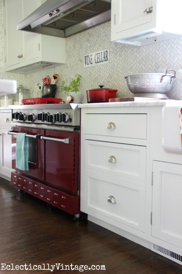 The red stove is the star of this white kitchen! kellyelko.com