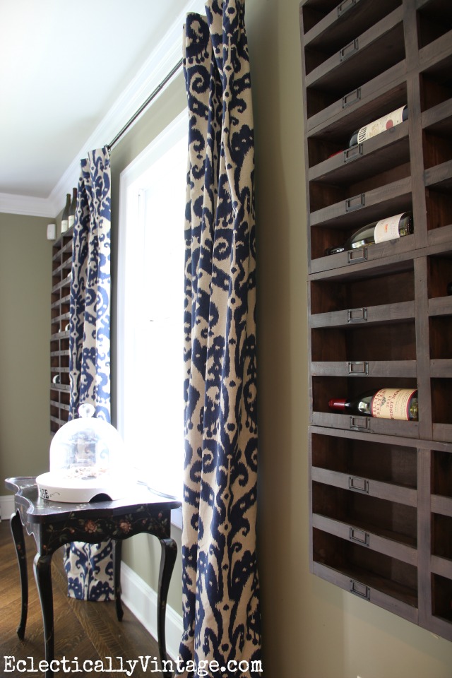 Love this wall of wine cubbies in this rustic dining room kellyelko.com