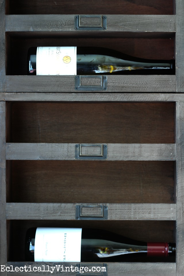 Love these wood wine cubbies and the vintage looking metal tags - display wine in style kellyelko.com