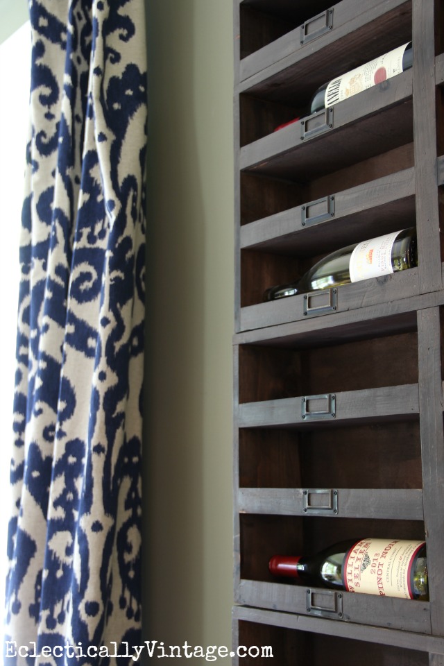 Love these rustic wood wine cubbies - they look amazing filling the walls of this dining room kellyelko.com