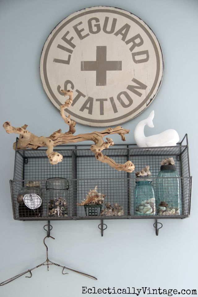 Love this Lifeguard Station sign in the bathroom and all of her coastal accessories kellyelko.com