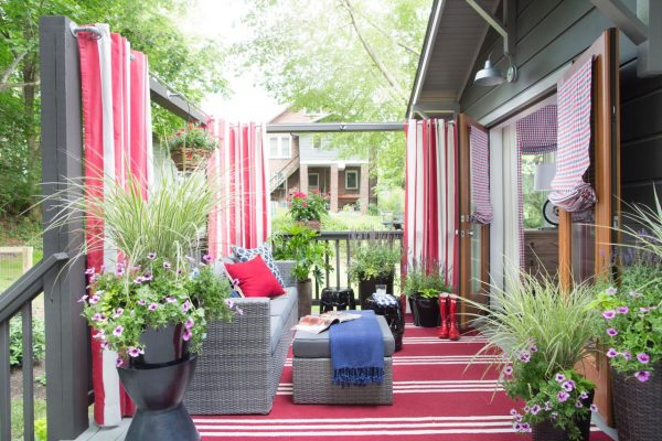 Outdoor deck - love the red striped curtains and rug kellyelko.com