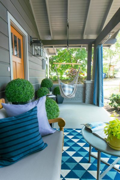 Cottage front porch - love the topiaries and the swing kellyelko.com