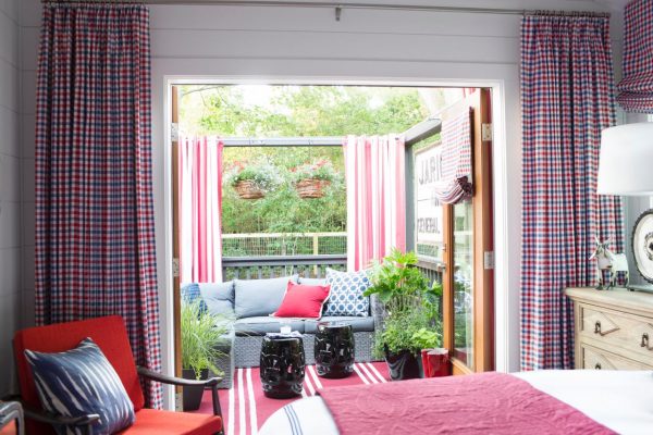 Country bedroom in blue and red - love the french doors leading to the deck kellyelko.com