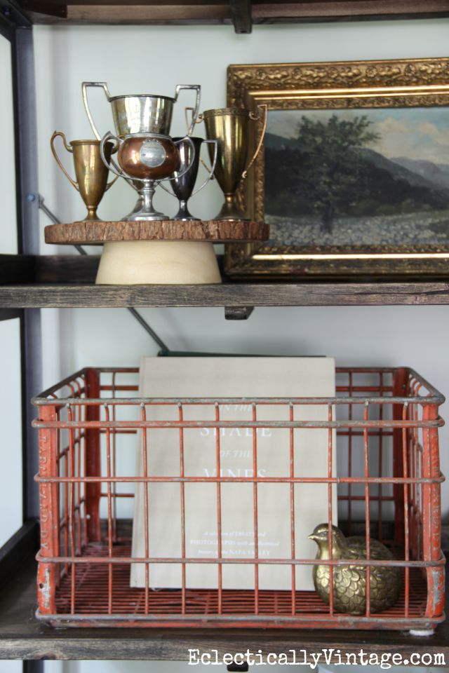 Love the artful arrangements on this open shelving and that vintage red crate kellyelko.com