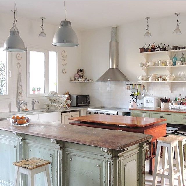 Love eclectic kitchens without upper cabinets. Great lighting, unique island and open shelving kellyelko.com