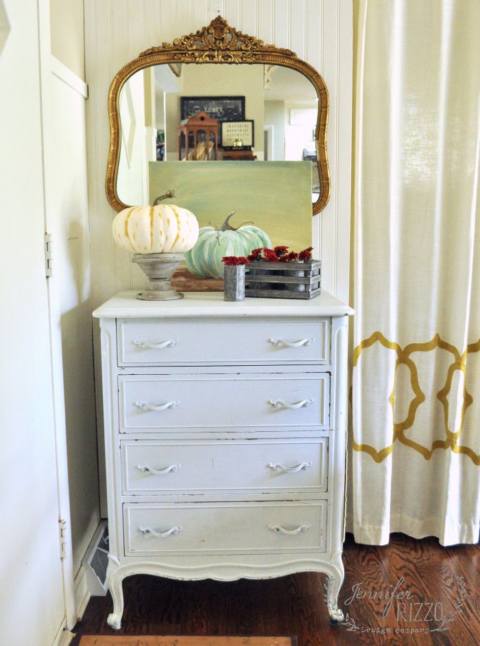 Love this vintage dresser and the pumpkin art 