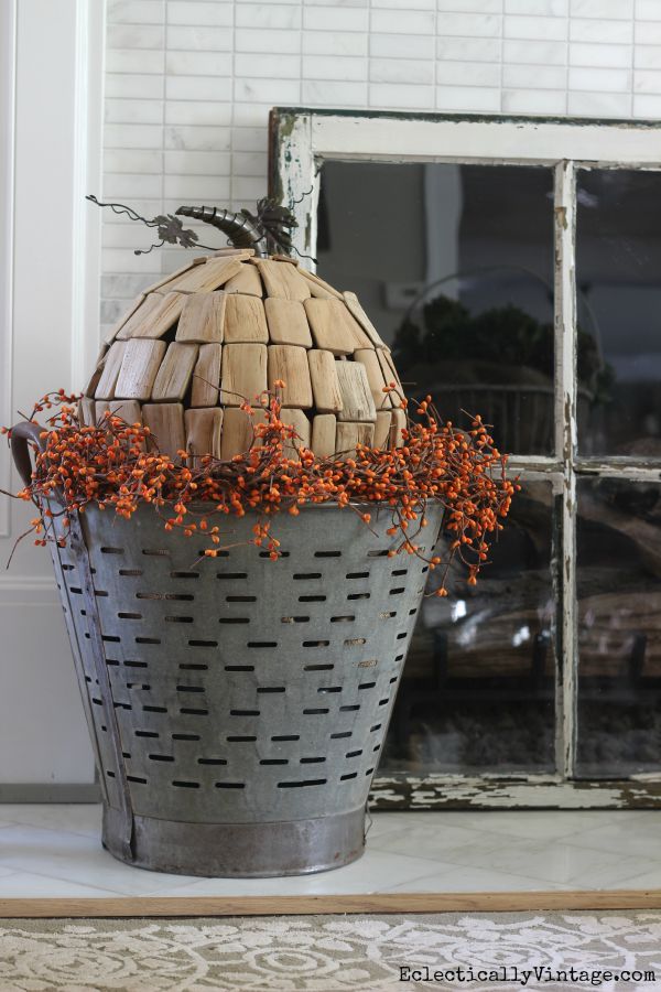 Love this driftwood pumpkin in an antique olive basket kellyelko.com