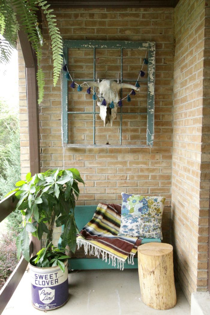 Love this boho porch and that cute tin planter kellyelko.com