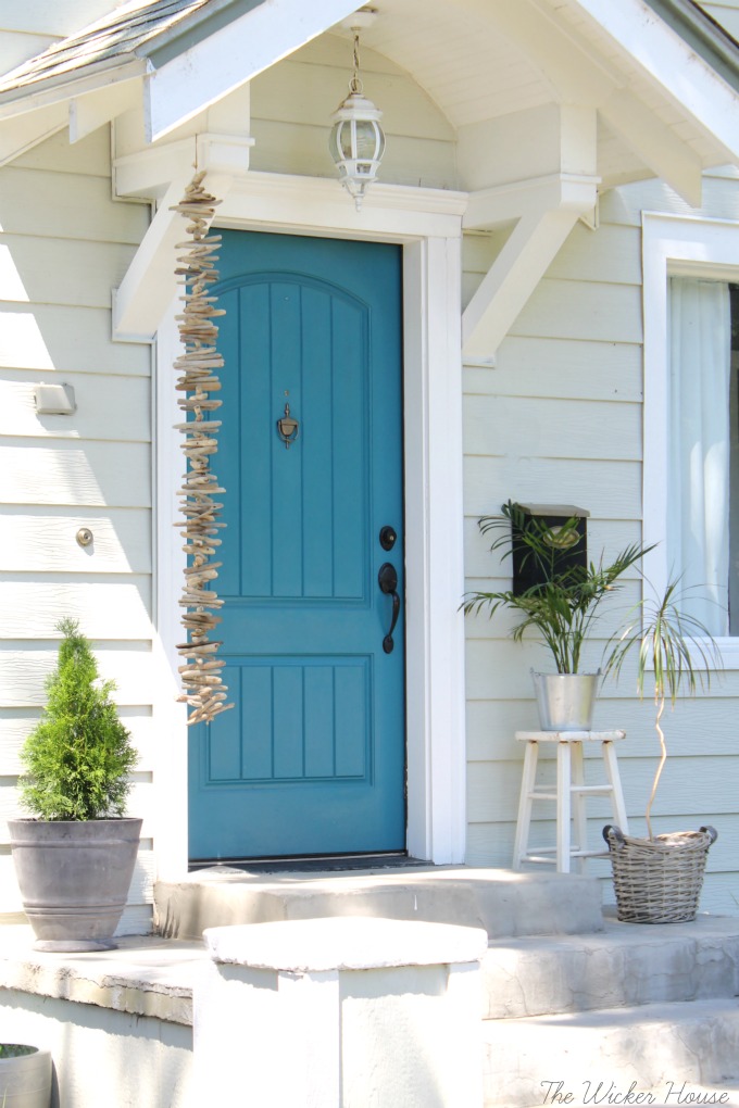 Love this blue front door - step inside to take the tour of this charming cottage of The Wicker House