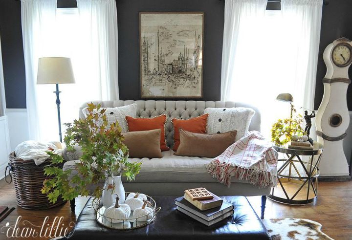 Beautiful fall living room - love the dark gray walls and neutral furniture with a pop of orange 