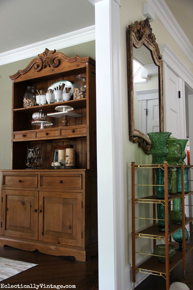 Dining room hutch filled with collections kellyelko.com