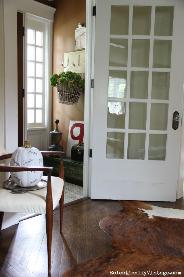 Fall entry - love the neutral colors and that metal basket filled with dried hydrangeas ecelcticallyvintage.com