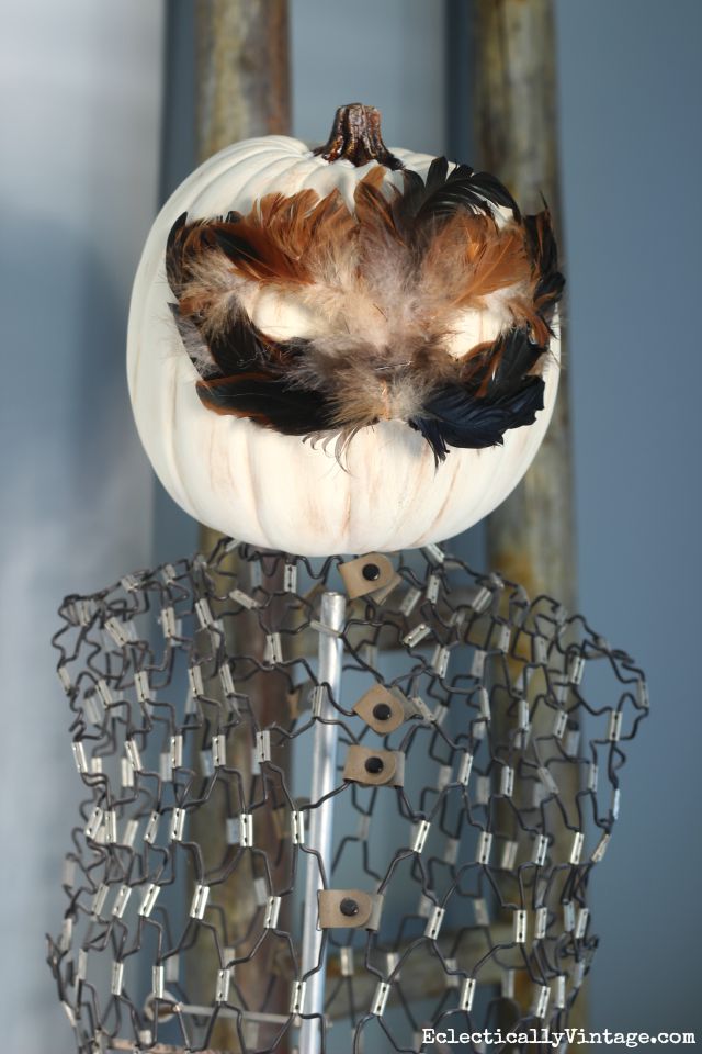 See how to make this Halloween pumpkin head feather mask - so fun on a vintage dress form kellyelko.com